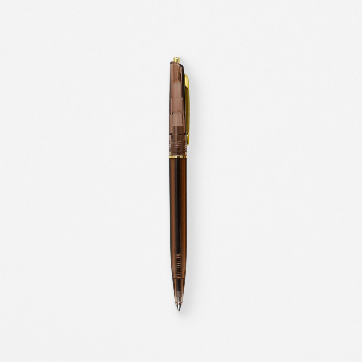 Anterique Ballpoint Pen in clear amber, translucent barrel with brass accents