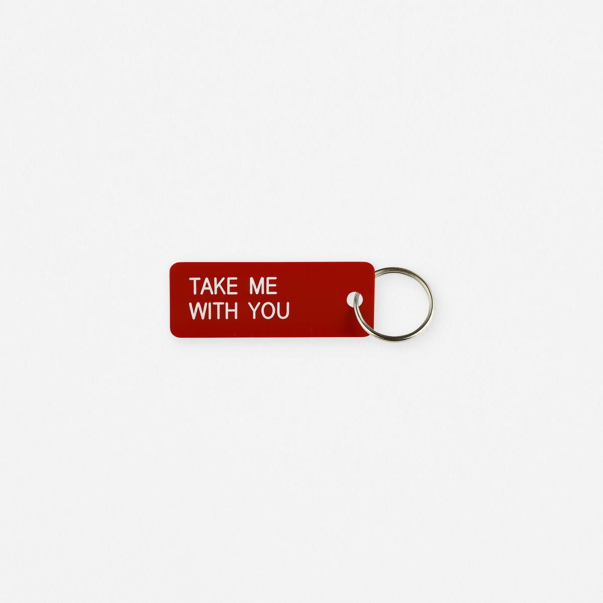 red key chain with phrase take me with you